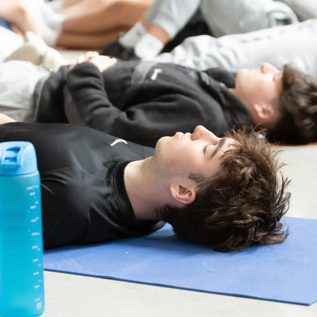 Breathwork to calm you from panic, anxiety & stress, Teenager laying on yoga mats