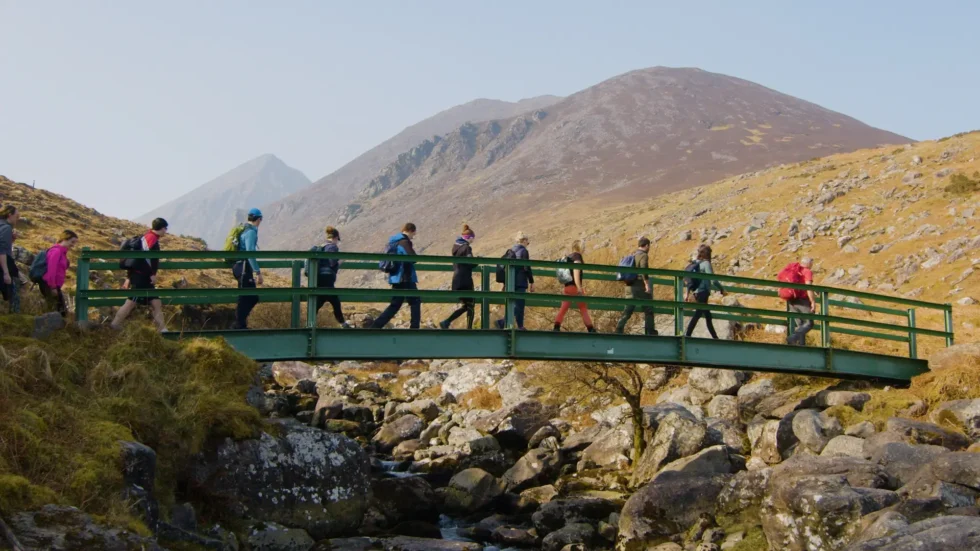 Hikers walking across Bridge