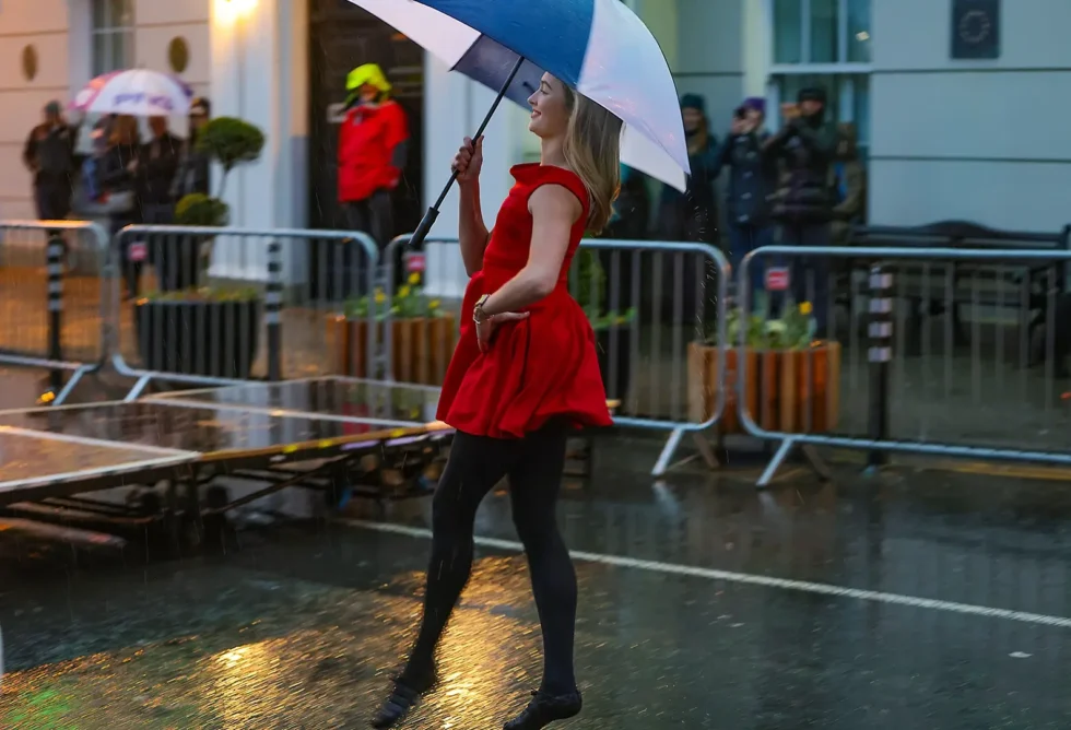 Wander Wild Festival ceremony irish dancing in the rain holding umbrella