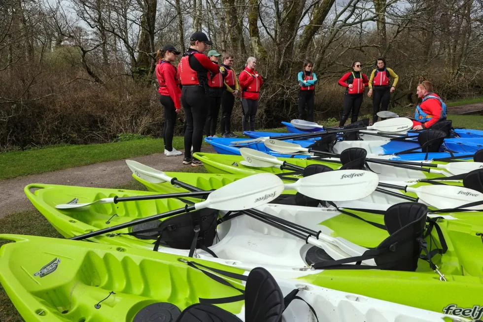 Wander Wild Festival group listening to kayaking instructor