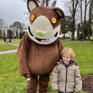 Gruffalo character stanging with child