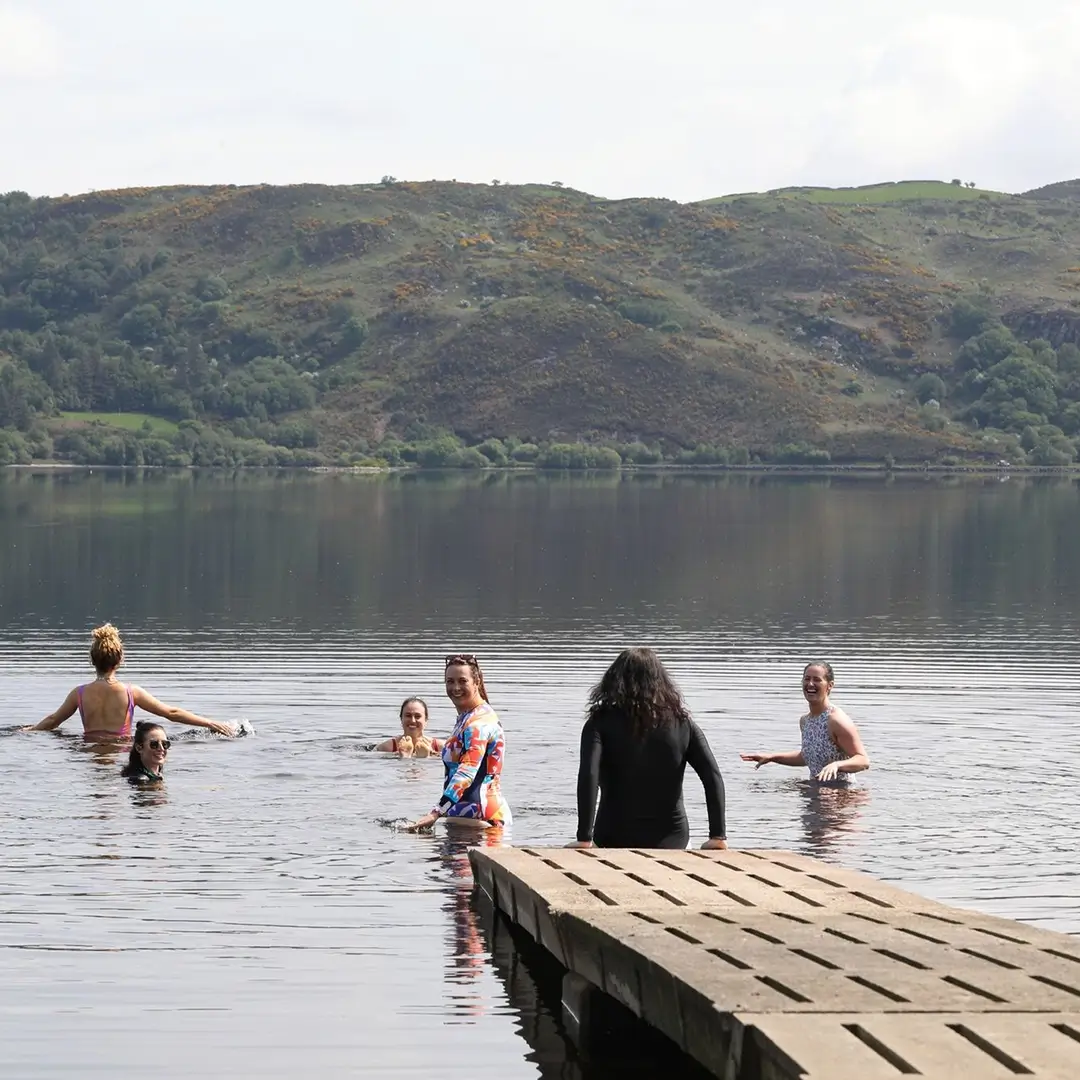 Women relaxing in lake near Loughdale Cottage