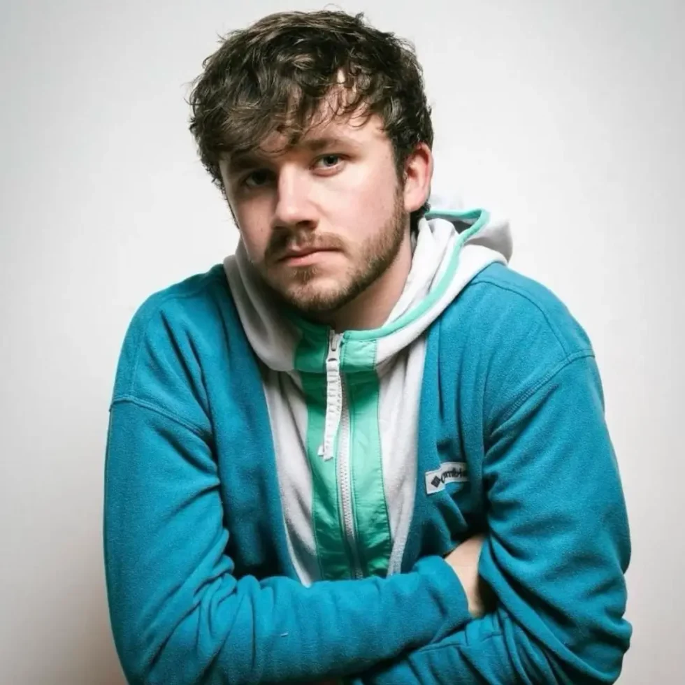 Donal Lucey profile photo with arms folded and wearing a blue top