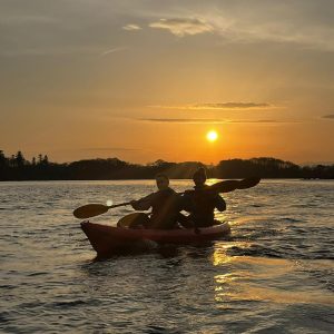 Two kayakers at dusk