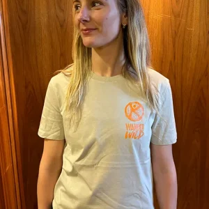 A lady wearing a wander wild desert dust tshirt