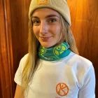 A lady wearing a green wander wild snood