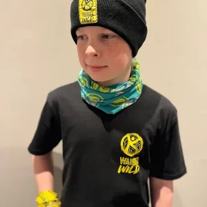 A young boy wearing a black kids tshirt from the wander wild festival merchandise