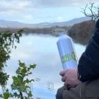 Taking a break on a hike with a water bottle