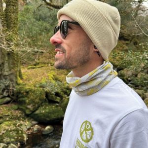 A man wearing a wander wild cuffed beanie