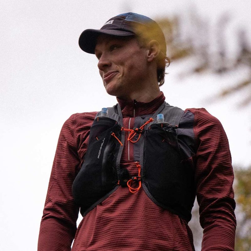 A trail runner wearing a water pack