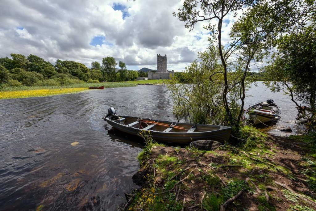 A boat docked near Ross Castle