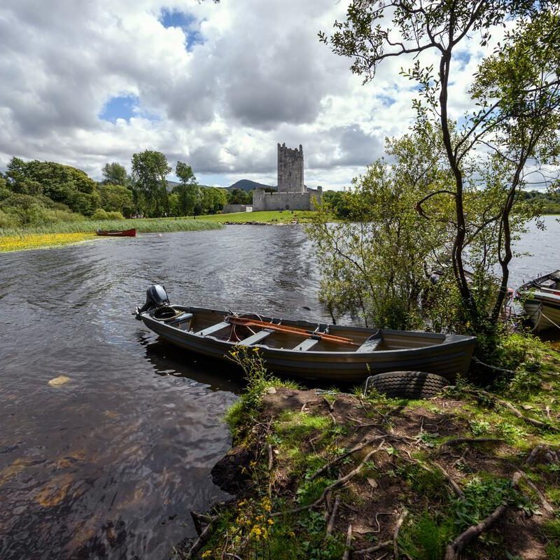 A boat docked near Ross Castle
