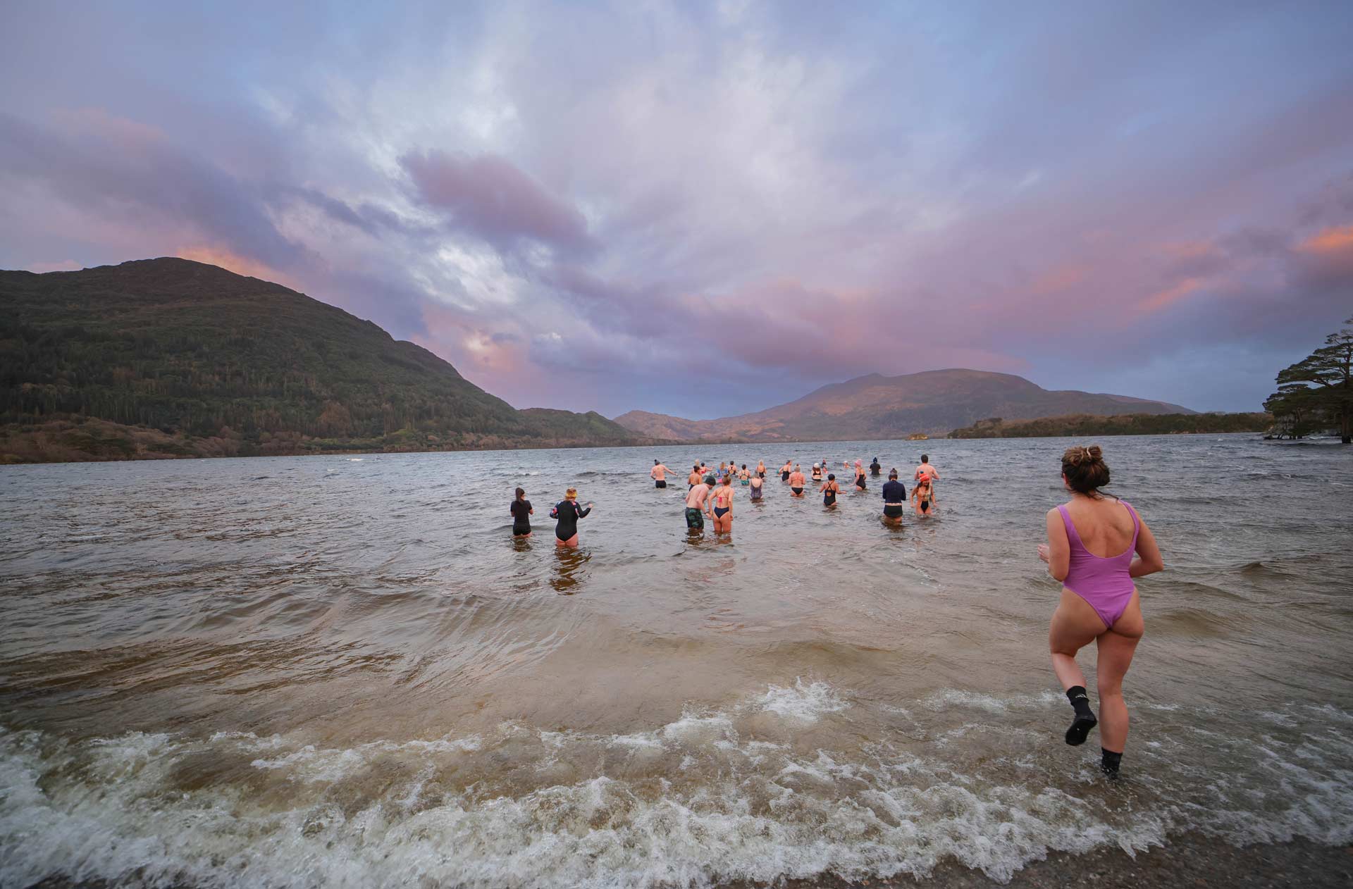 Swimmers running into the lakes of Killarney